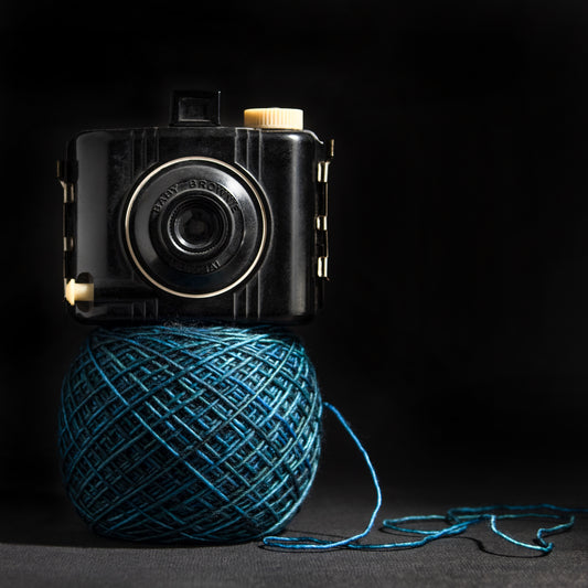Porterness Studio Framed Photographic Print - Blue Yarn Cake with Vintage Camera